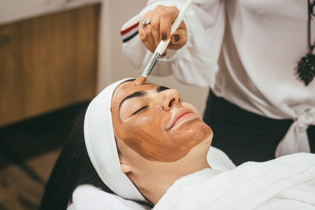 A client having a facial treatment applied